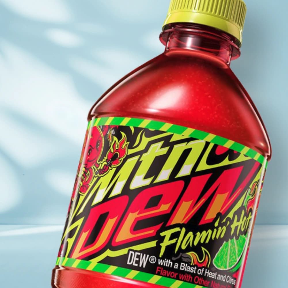 Bottle of Mtn Dew Flamin Hot on blue background.